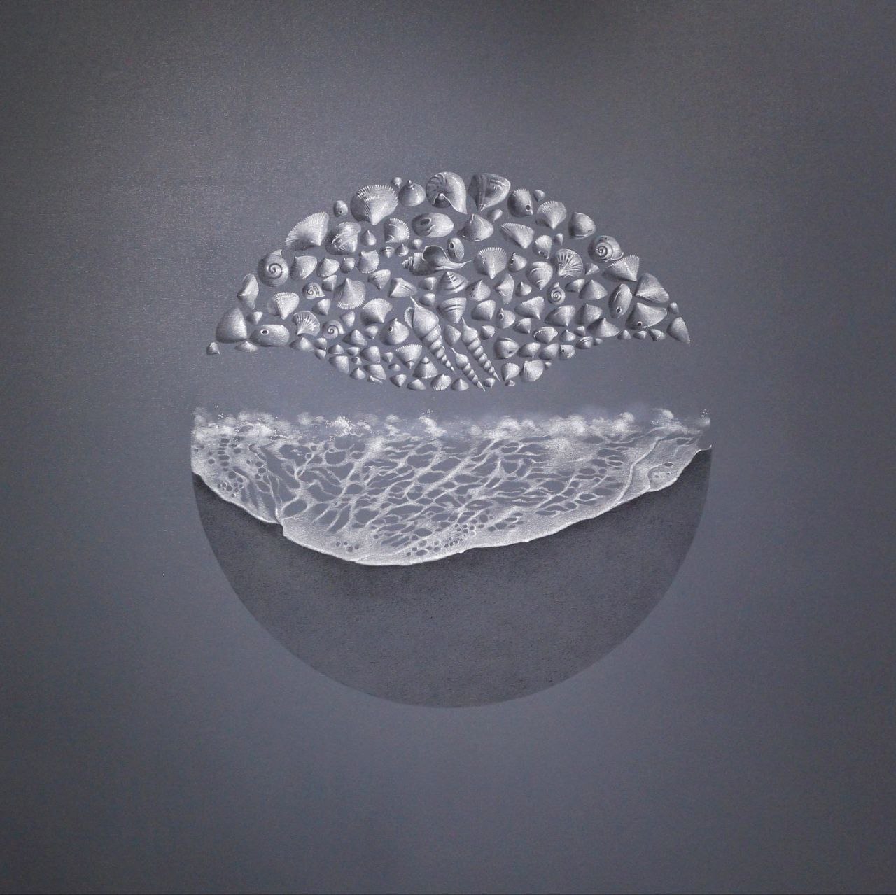 Circular sculpture showing the world map outline surrounded by sea foam, waves, and seashells.